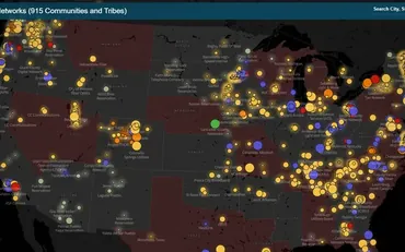 The ILSR community network map, hundreds of coloured dots for municipal and tribal networks across the US, over states shaded dark red where public networks are preempted.